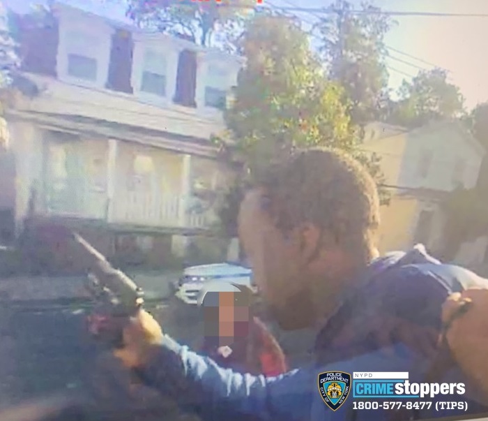 Image of suspect holding a gun